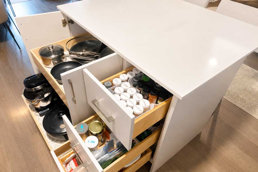 New island with pull-out drawers and quartz countertop
